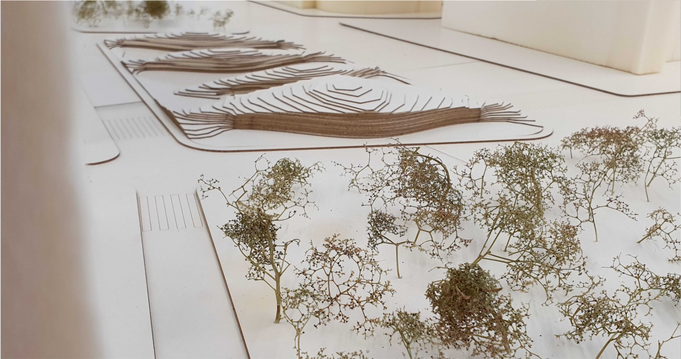 Green corridor and earth-sheltered volumes creating a child-scaled urban landscape.