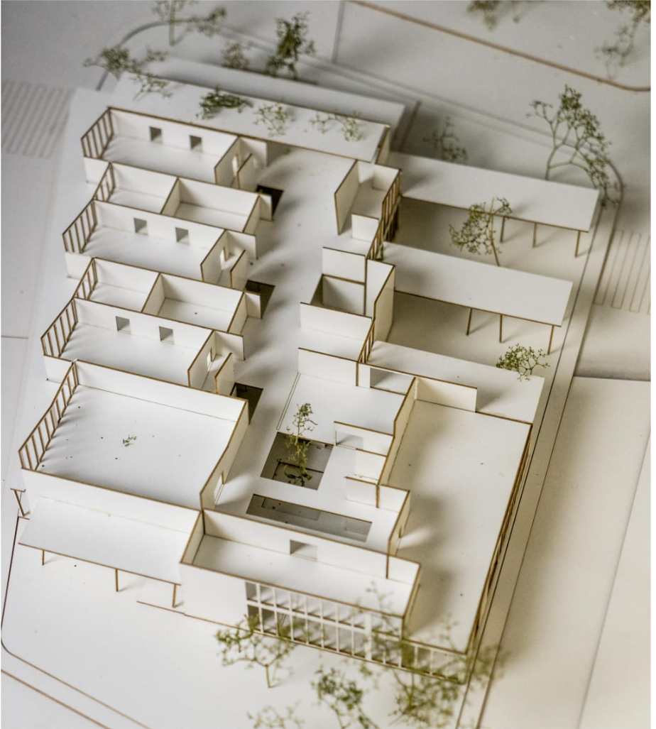 Bird’s-eye physical model highlighting the consolidated building form that reduces heat loss and exterior surface exposure.