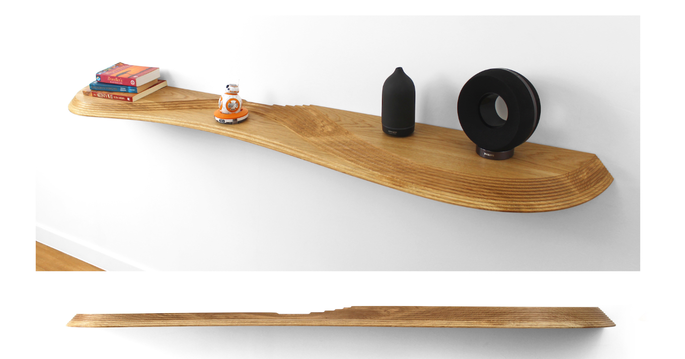 The long shelf configuration transforms wall-mounted storage into a continuous architectural element.