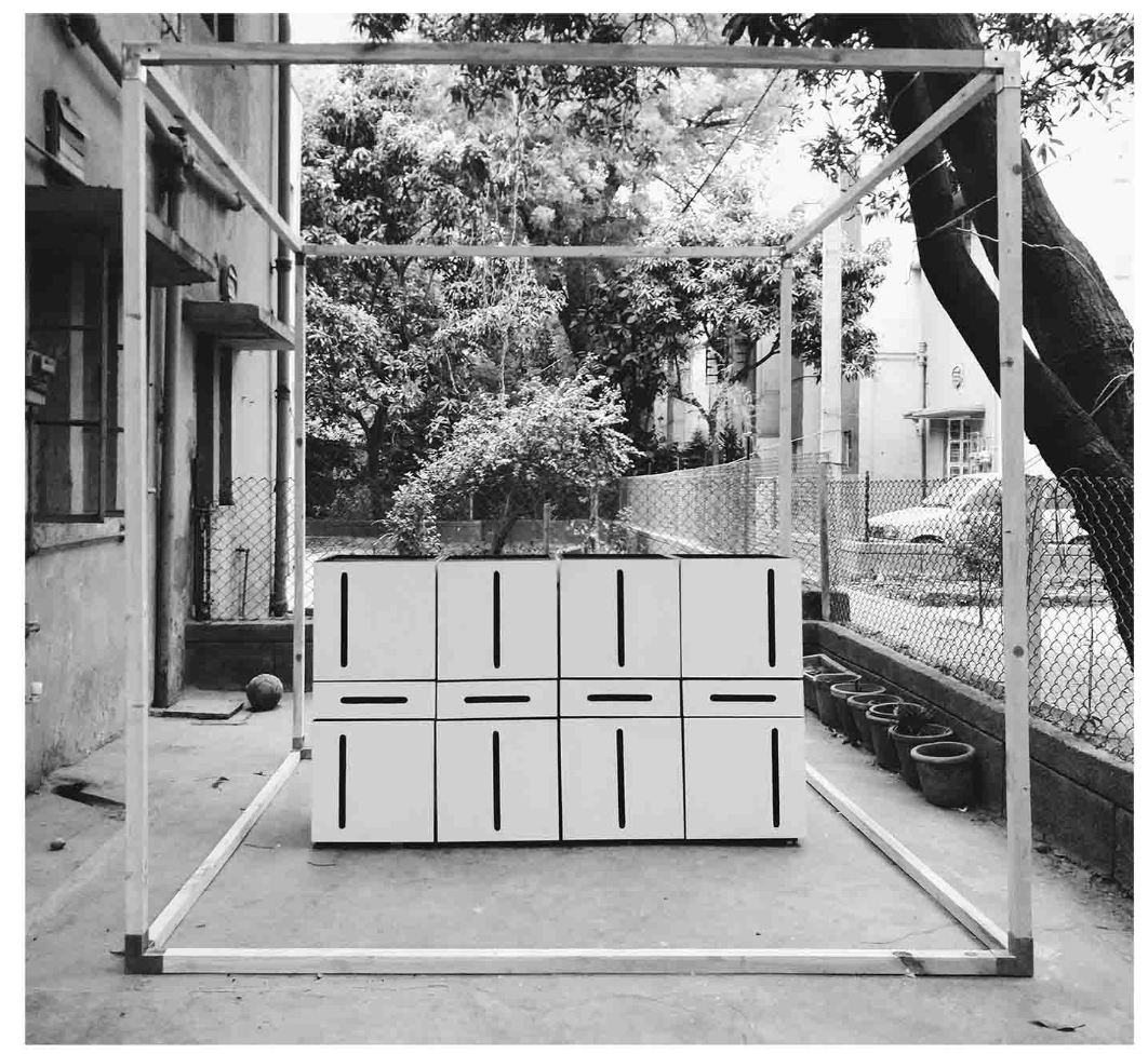 Temporary structural frame defining the spatial boundary of the furniture installation.