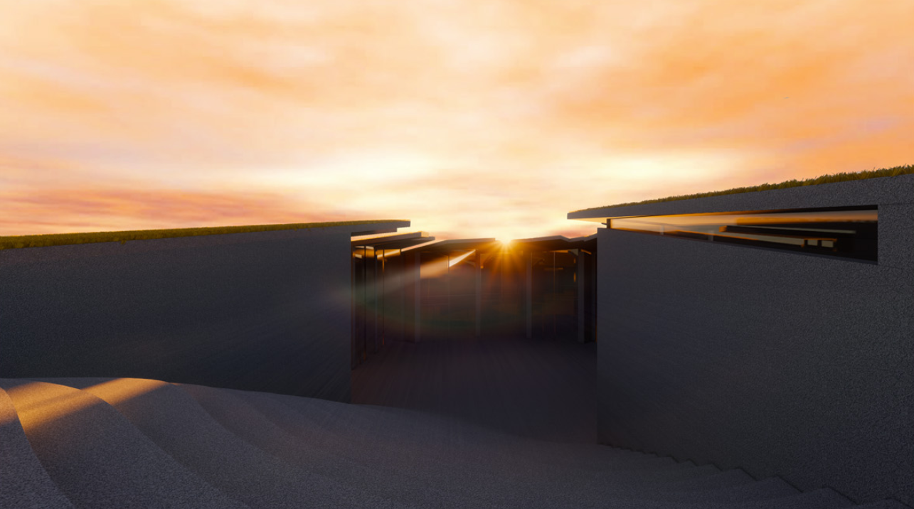 Sunken courtyard entrance filtering daylight into the underground living clusters.