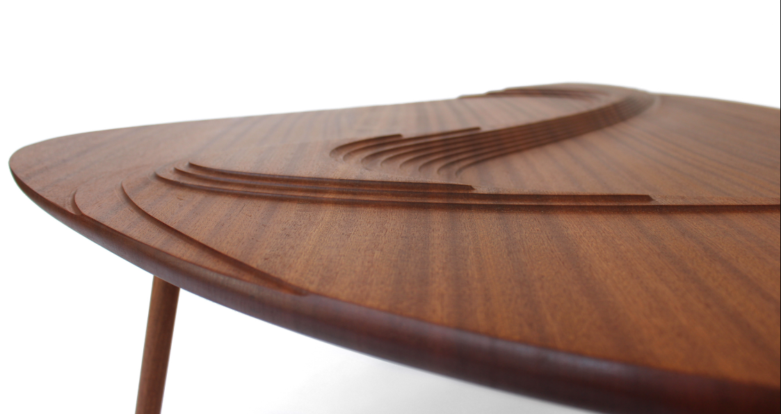Layered carvings that create depth through light and shadow.