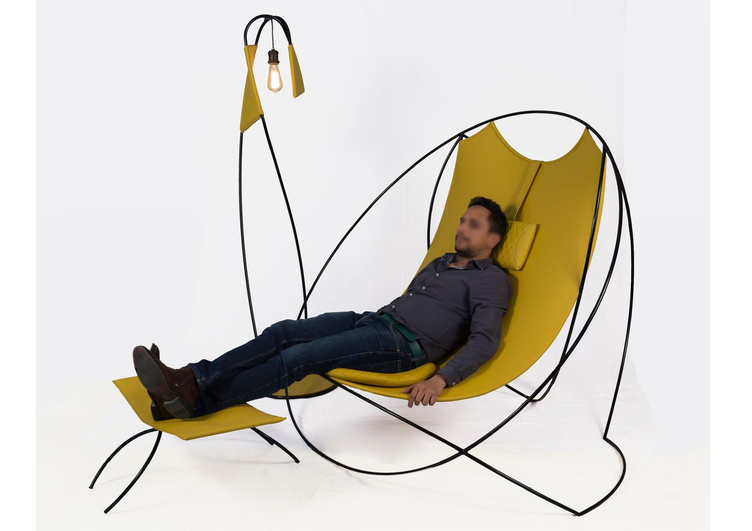 ABC footrest designed as a complementary element, extending comfort through lightweight, curved steel framing.