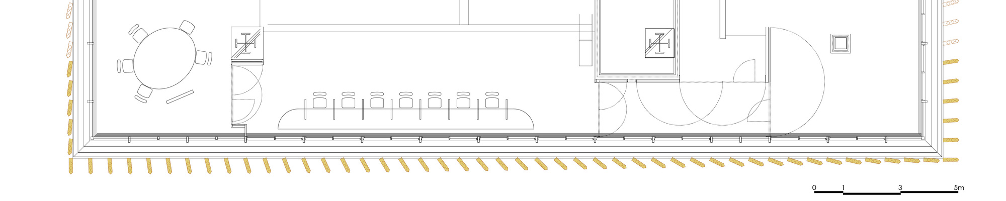 Floor plan drawing showing an elongated interior with round table, long dining table, and bathroom fixtures