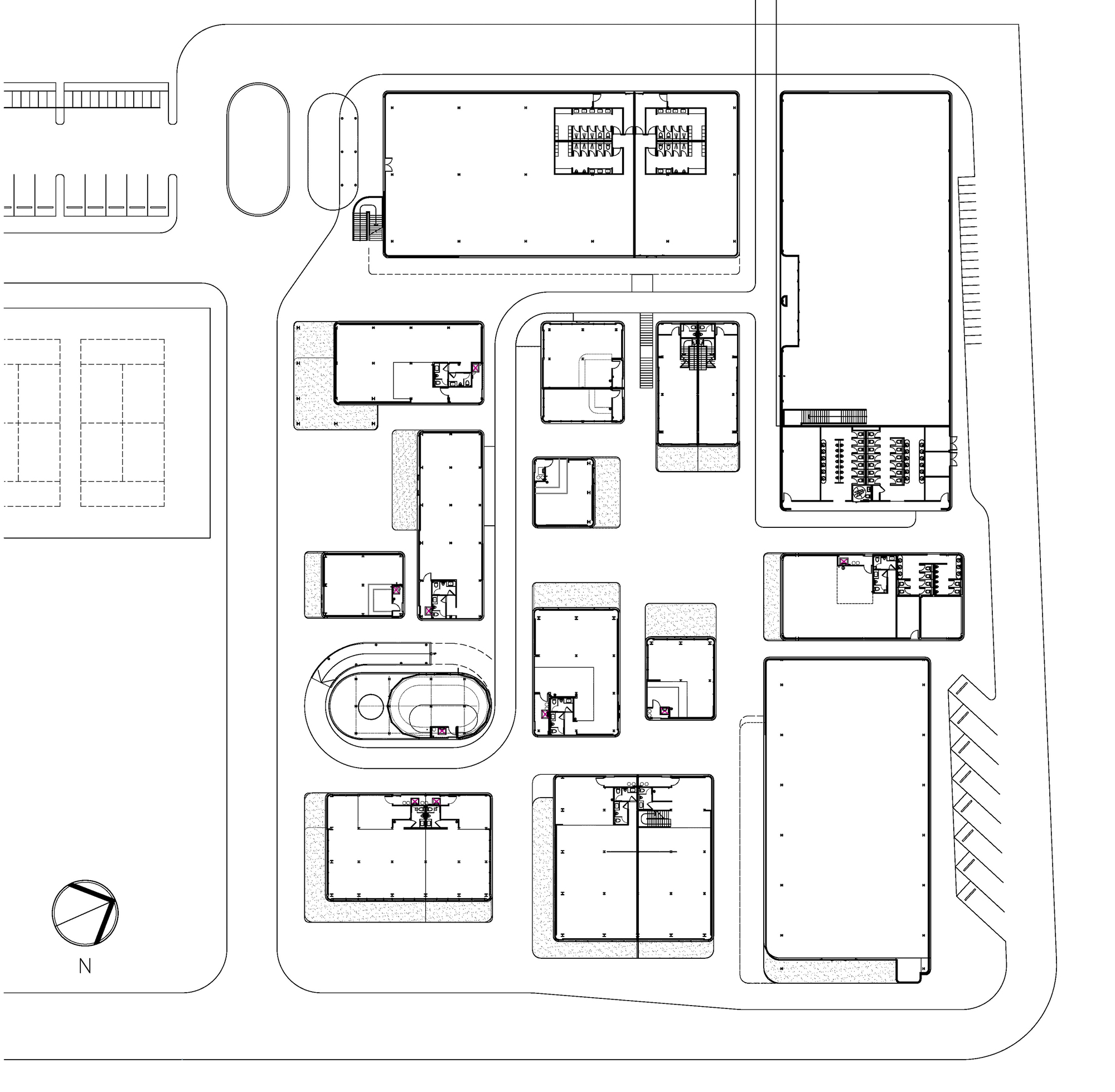 Site plan drawing showing multiple rectangular buildings arranged around a central oval structure