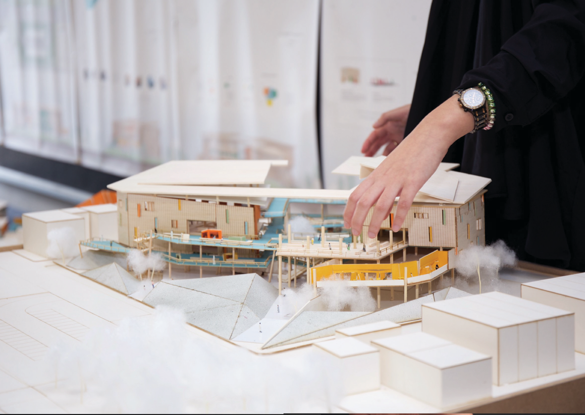 Physical study model illustrating the interconnected platforms, ramps, and open courtyards shaping the project’s spatial circulation.