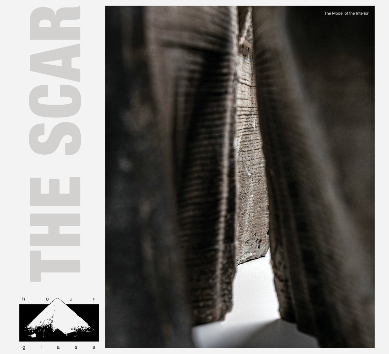 A narrow incision through textured material reveals the spatial essence of “The Scar,” where architecture emerges as a wound within matter.