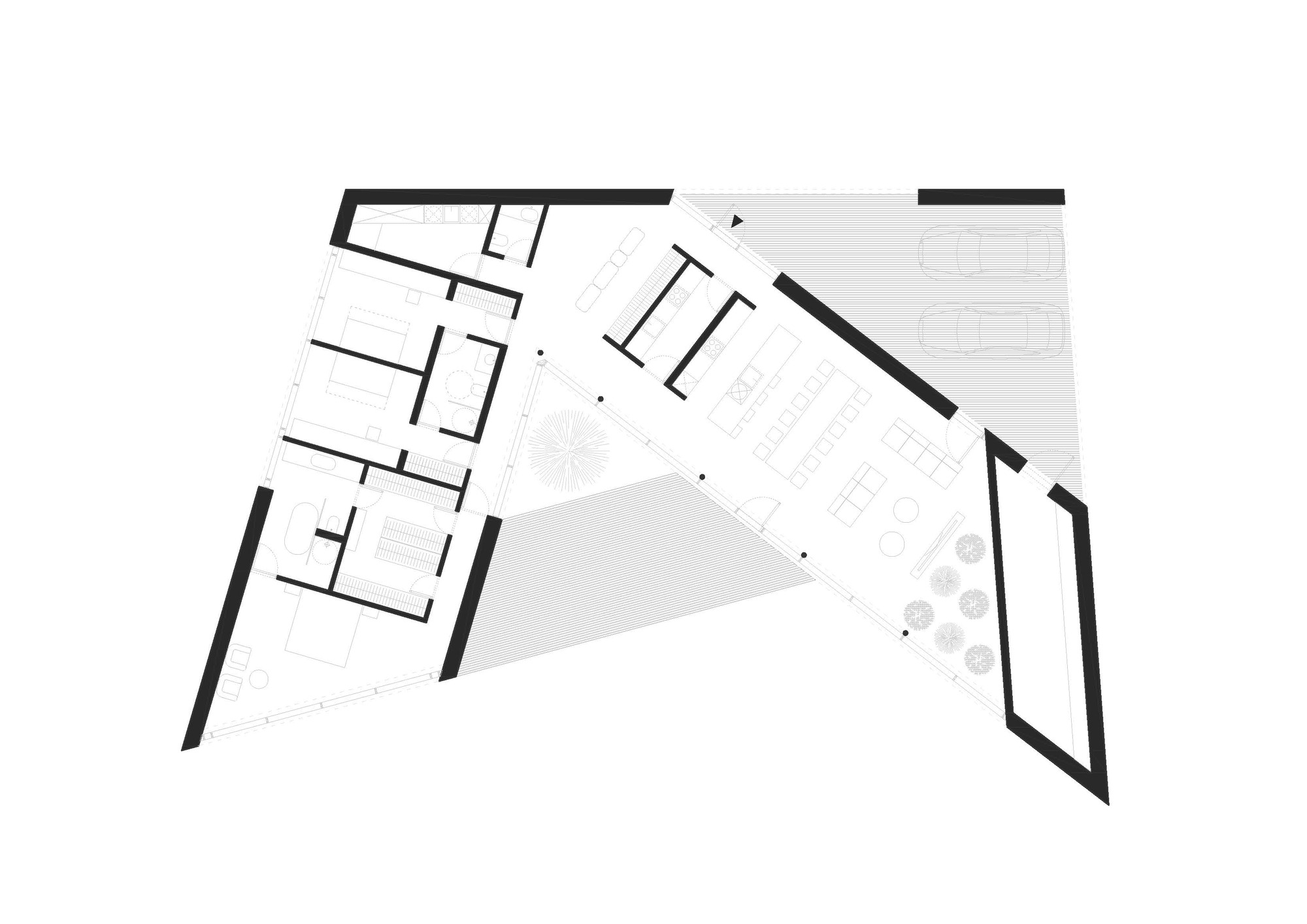 Floor plan drawing showing two angled wings connected by a central triangular courtyard