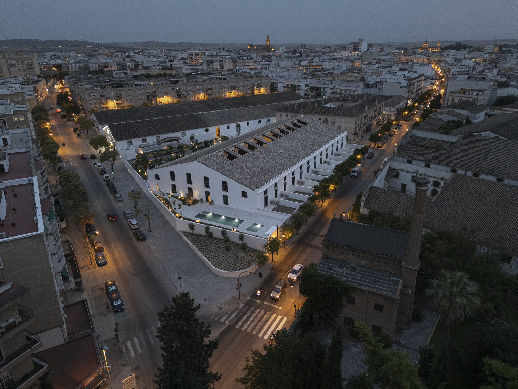 Aerial dusk view of the converted sherry bodega complex in Jerez de la Frontera