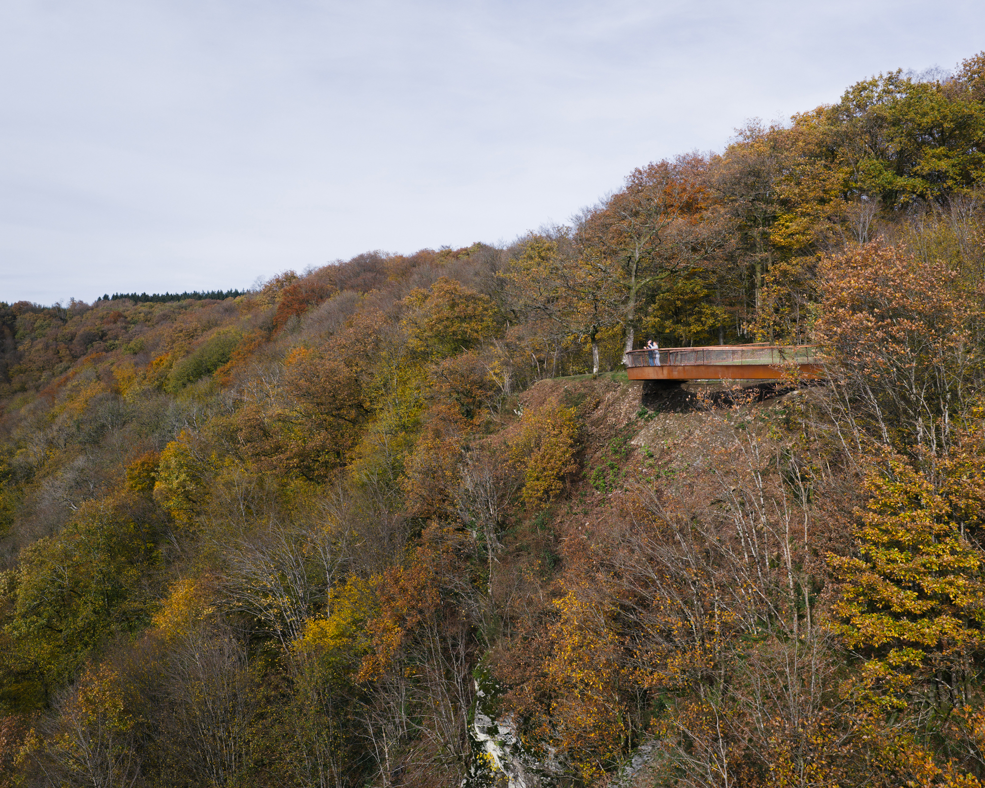 Distant side view of the cantilevered overlook from across the valley