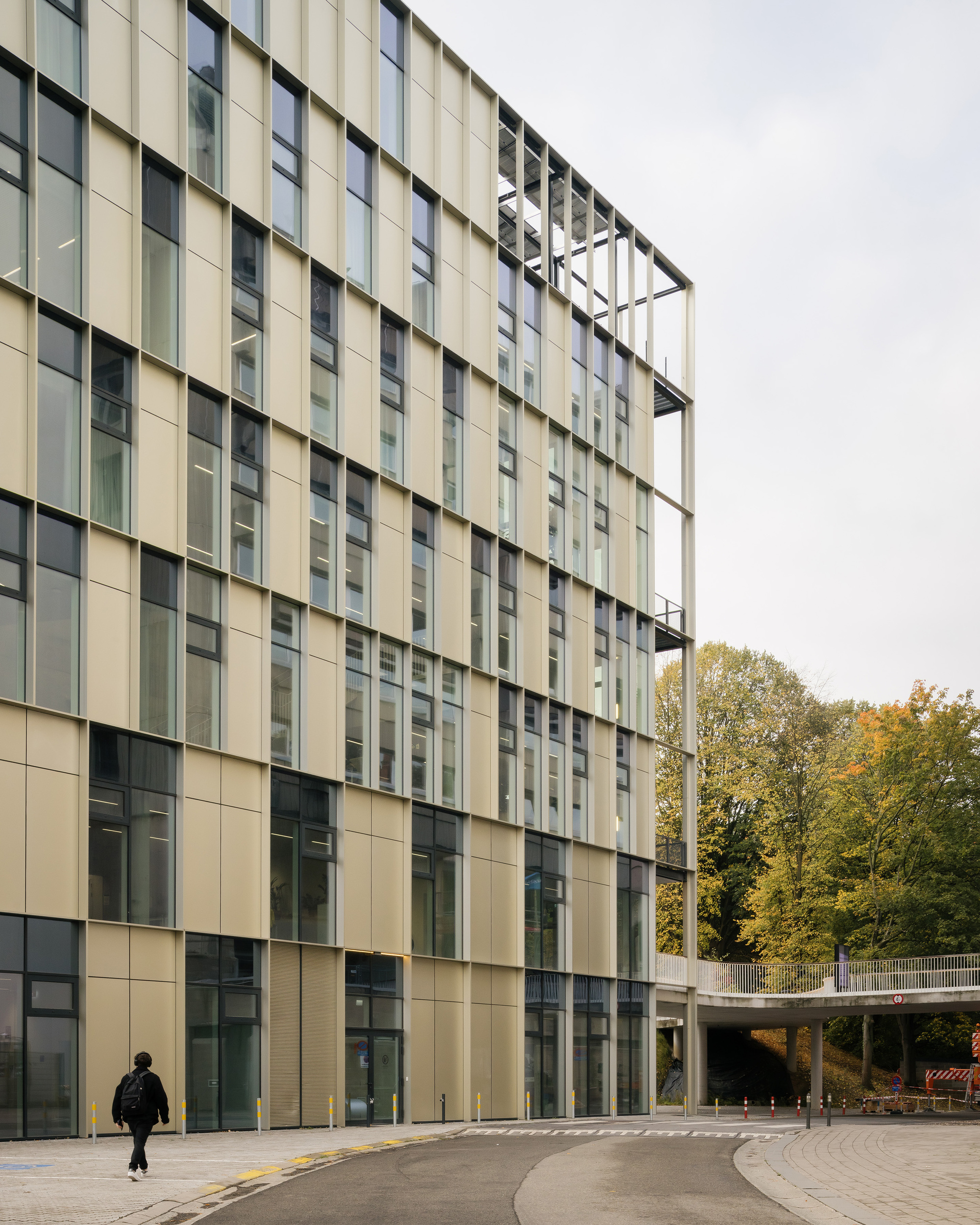 Glazed facade and a covered walkway connecting to a neighbouring campus building