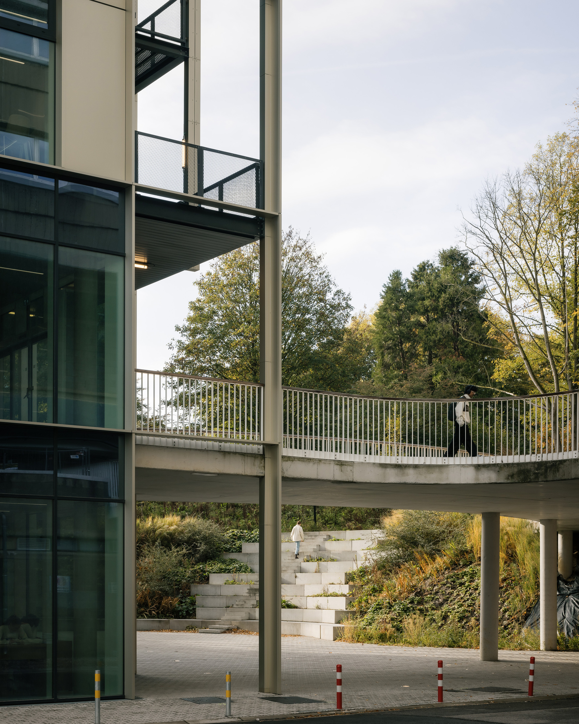 Elevated walkway and the curved retaining wall to the planted slope below
