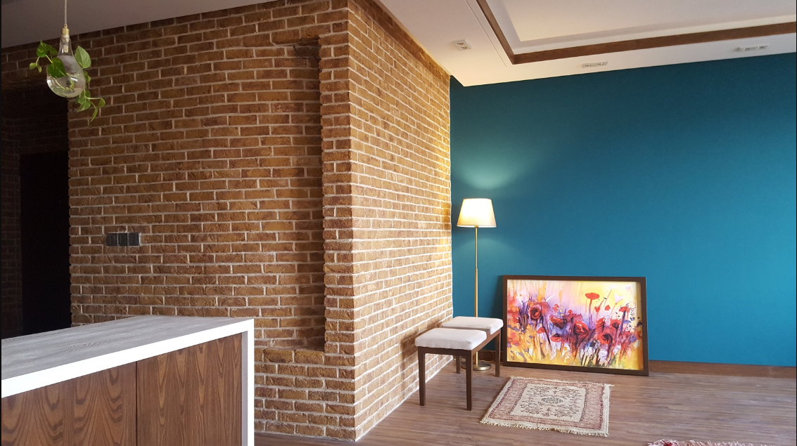 A refined corner composition where brick, wood, and color create a balanced residential interior experience.