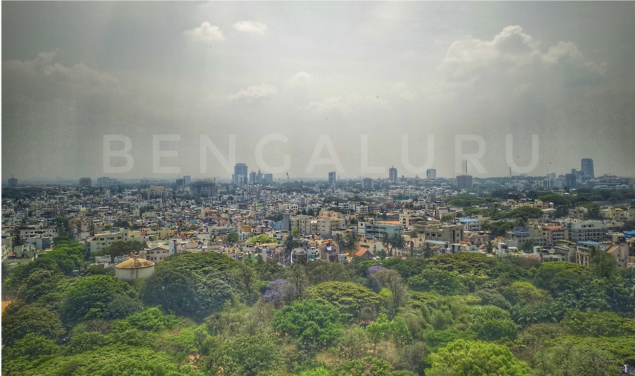Bengaluru skyline viewed from the reclaimed quarry landscape, highlighting the urban context surrounding the White Rocks Quarry site.