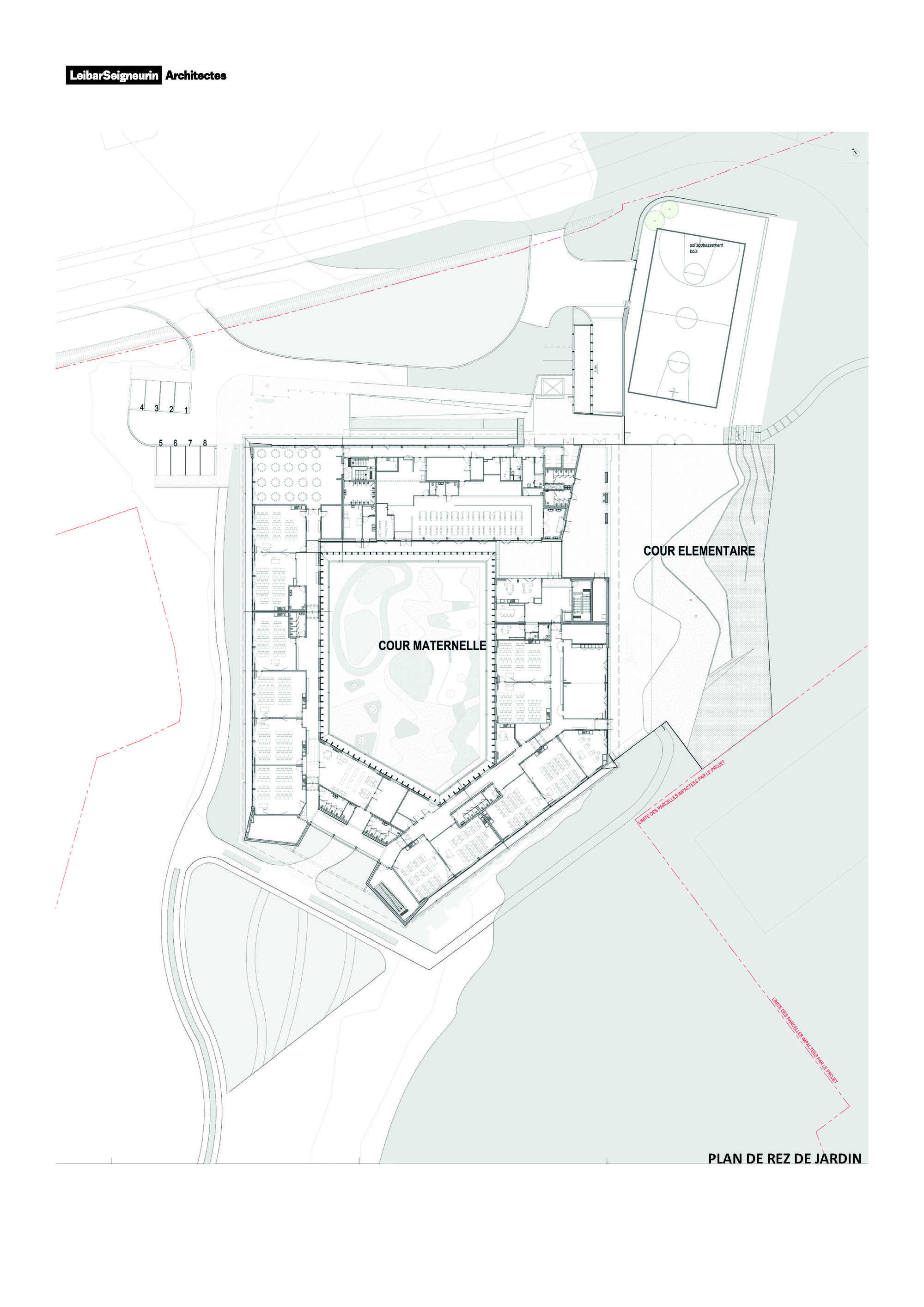 Ground floor plan drawing showing classroom wings with two courtyards and adjacent sports field