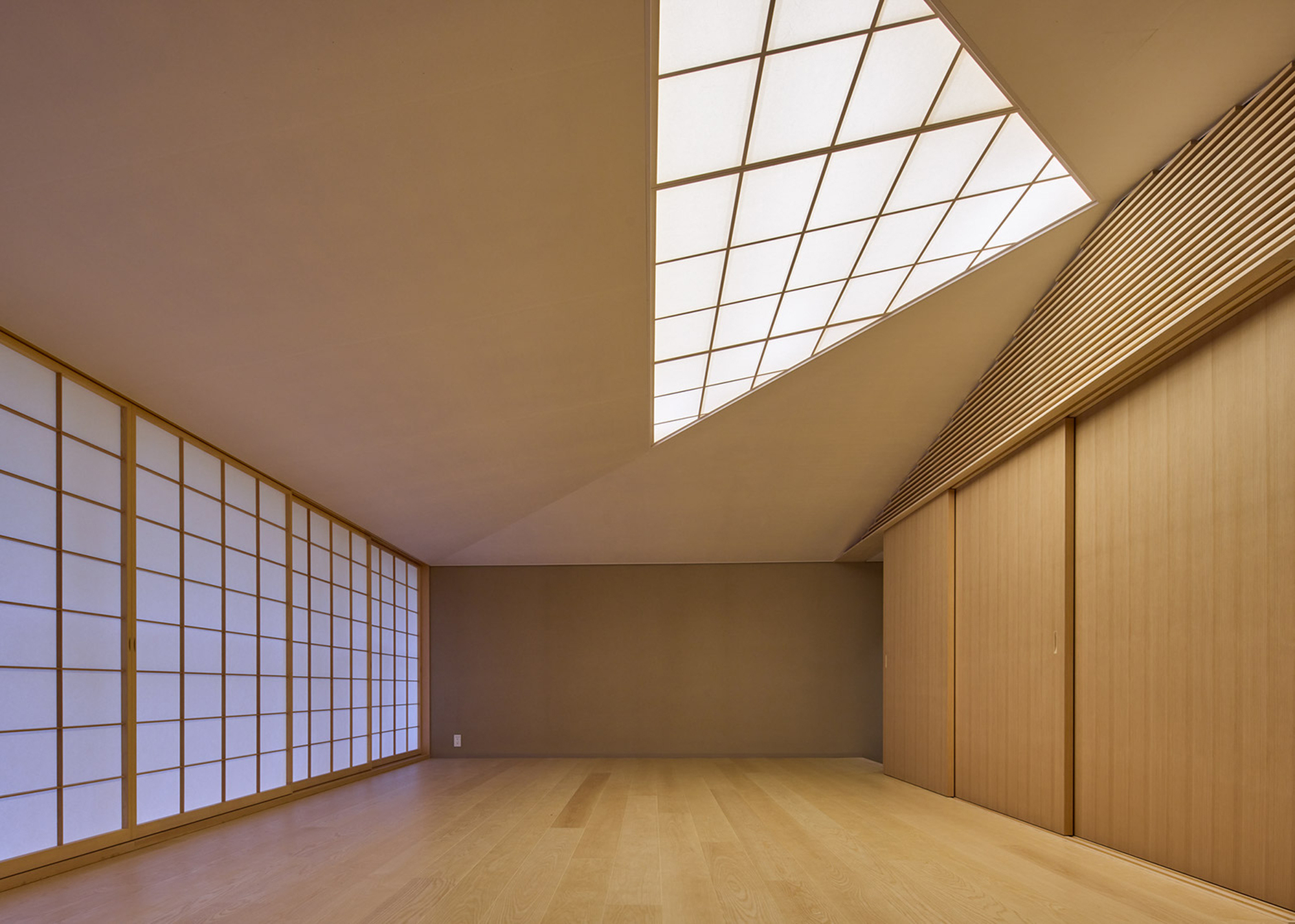 Interior room with translucent shoji screens and angular skylight casting diagonal shadows