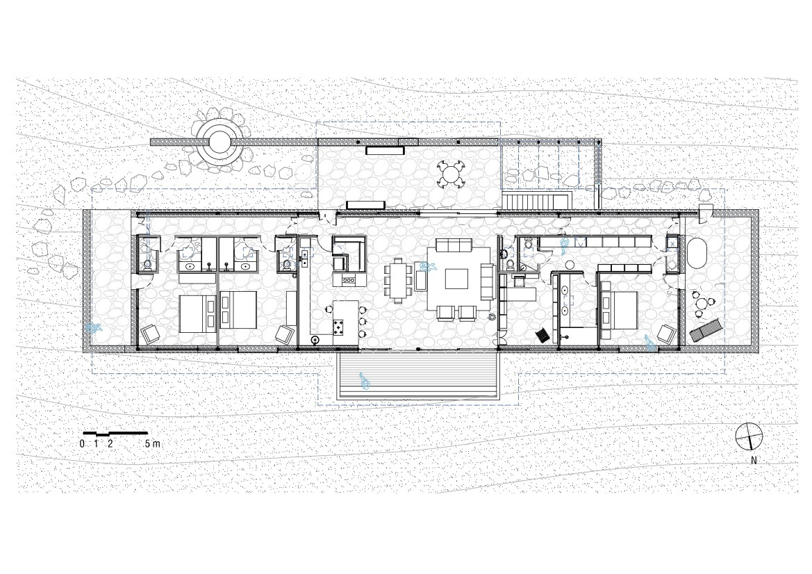 Floor plan drawing showing linear arrangement of bedrooms and living spaces with central courtyard