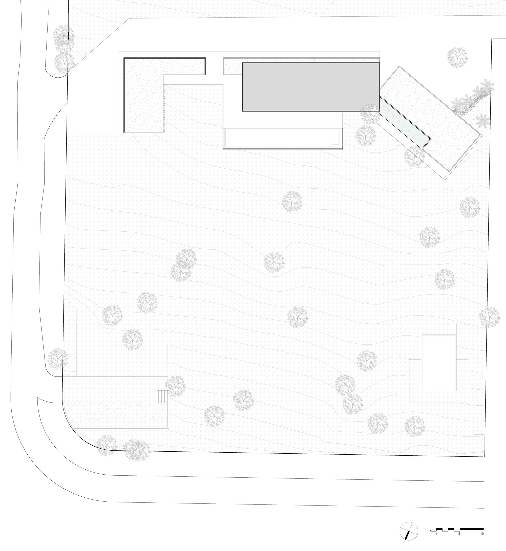 Site plan drawing showing orthogonal building volumes and scattered trees across a sloping lot