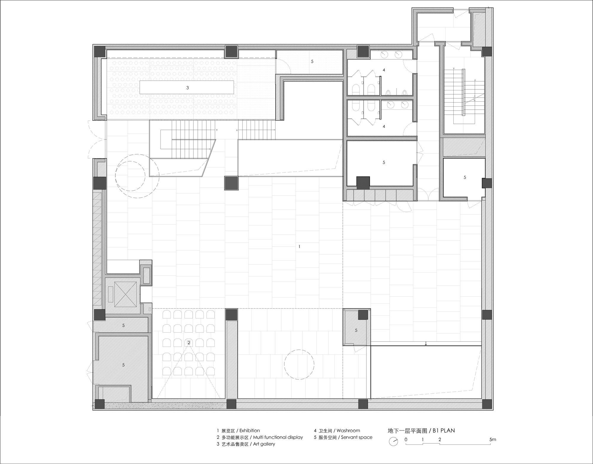 First floor plan drawing showing an open layout with exhibition space, staircase, and service rooms
