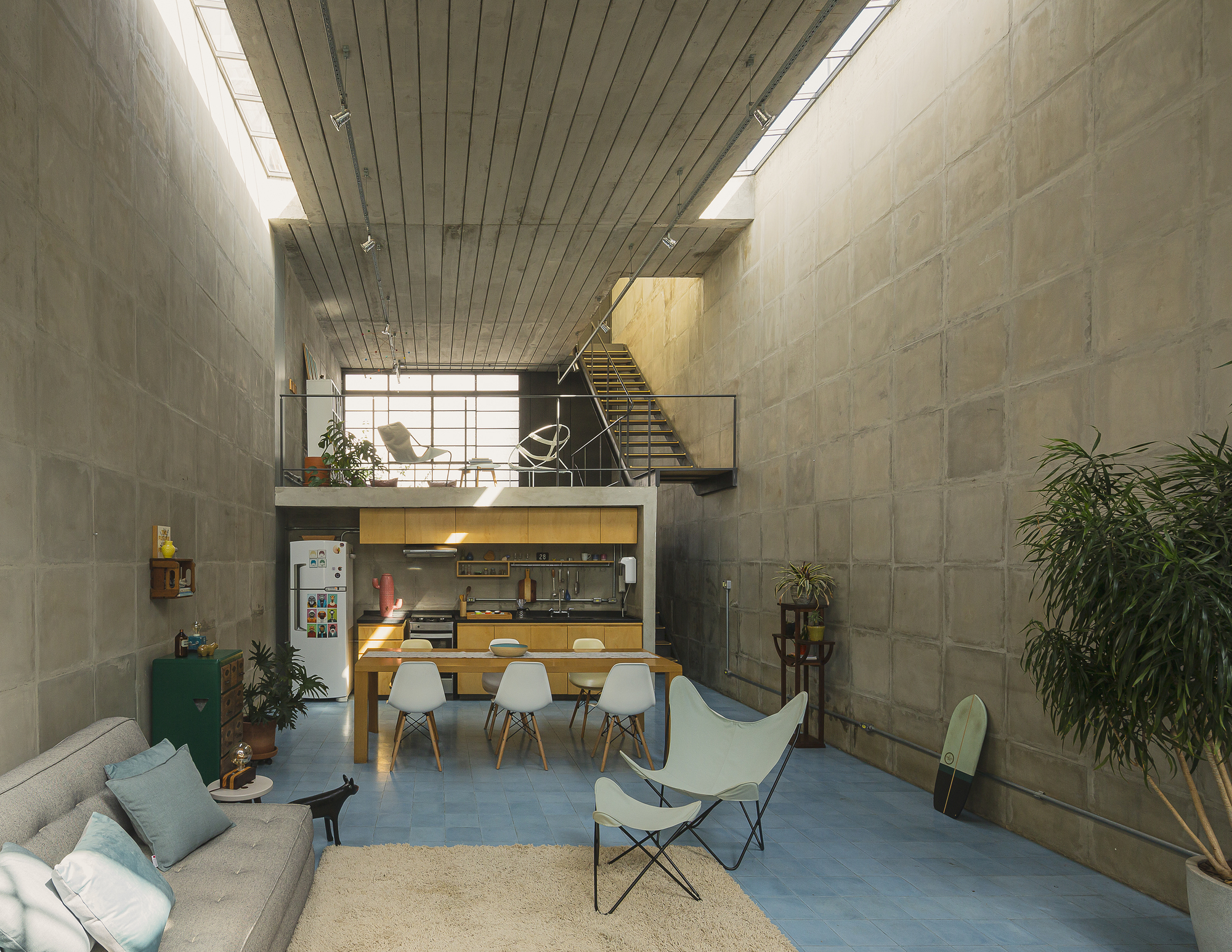 Living area with concrete block walls and continuous clerestory glazing along ceiling edge