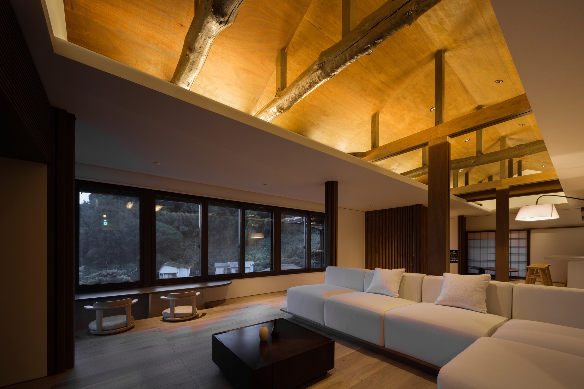 Double height space with vaulted timber coffers and central post supporting upper level