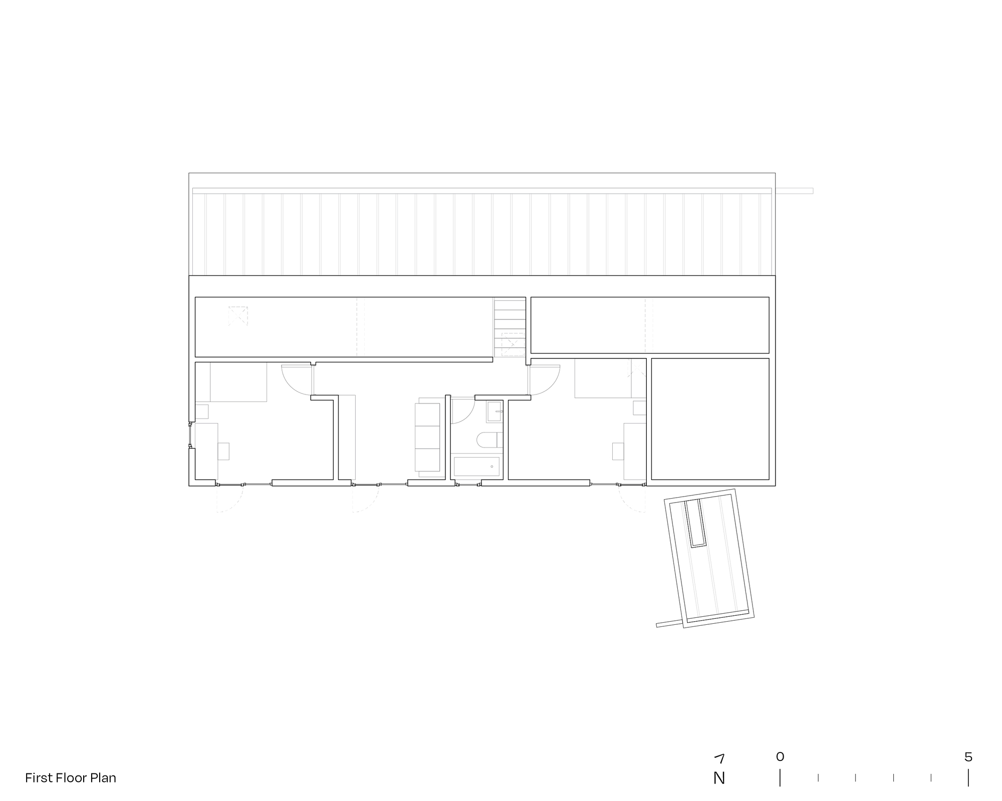 First floor plan drawing showing bedroom spaces with a pitched roof indicated above