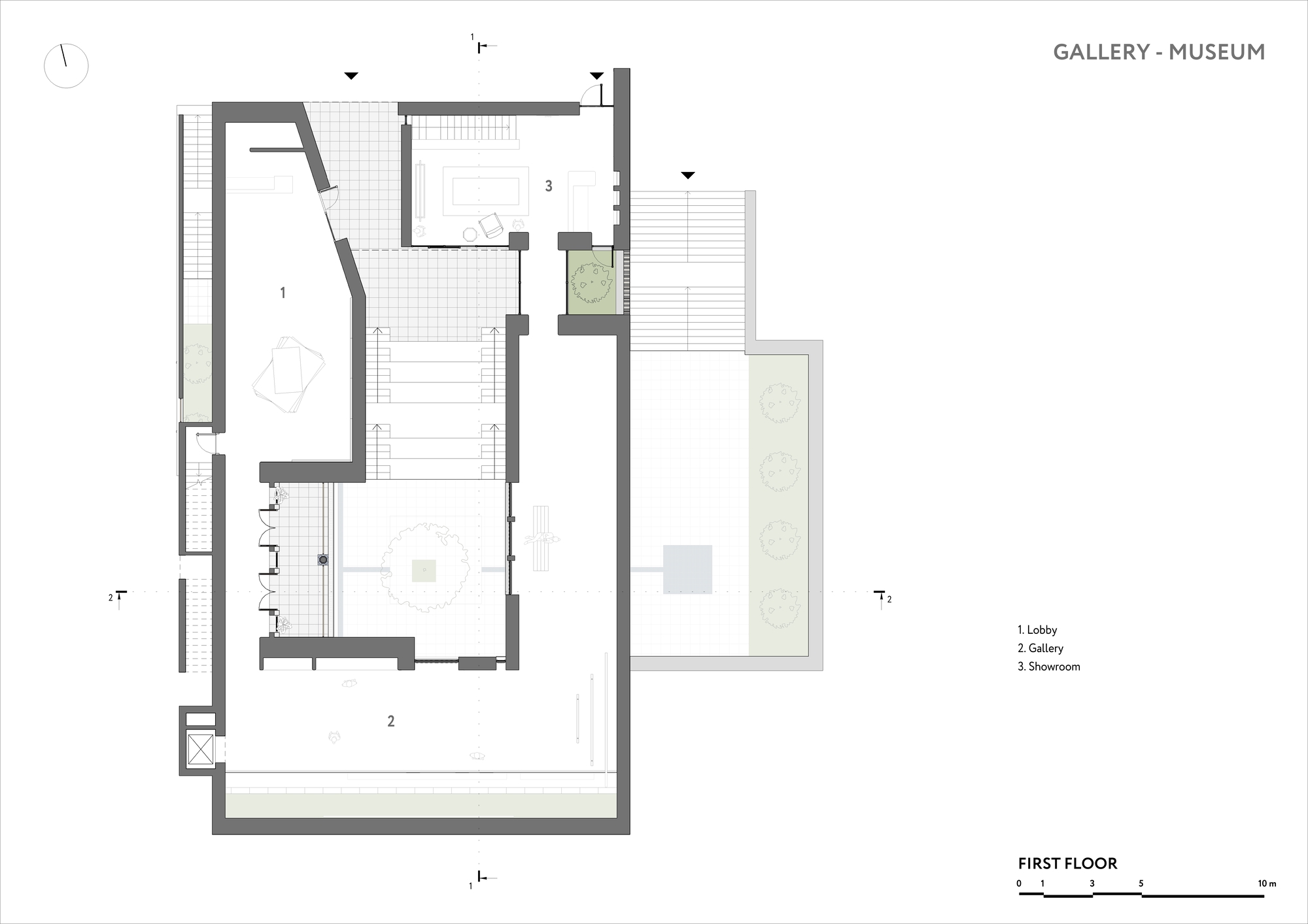 First floor plan showing lobby, gallery and showroom spaces with exterior planted areas