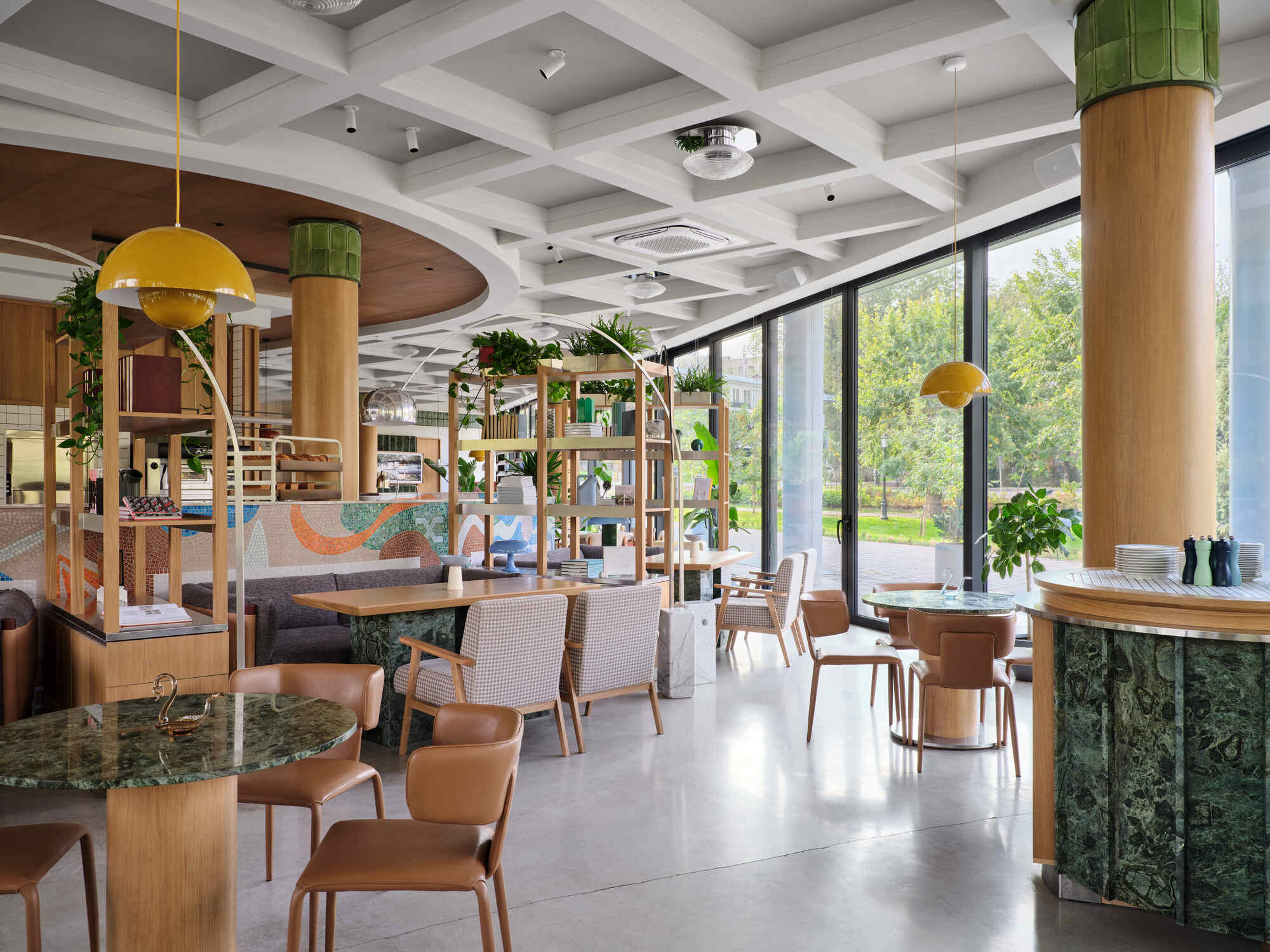 Interior view showing timber-wrapped column with green tile capital and shelving unit with potted plants