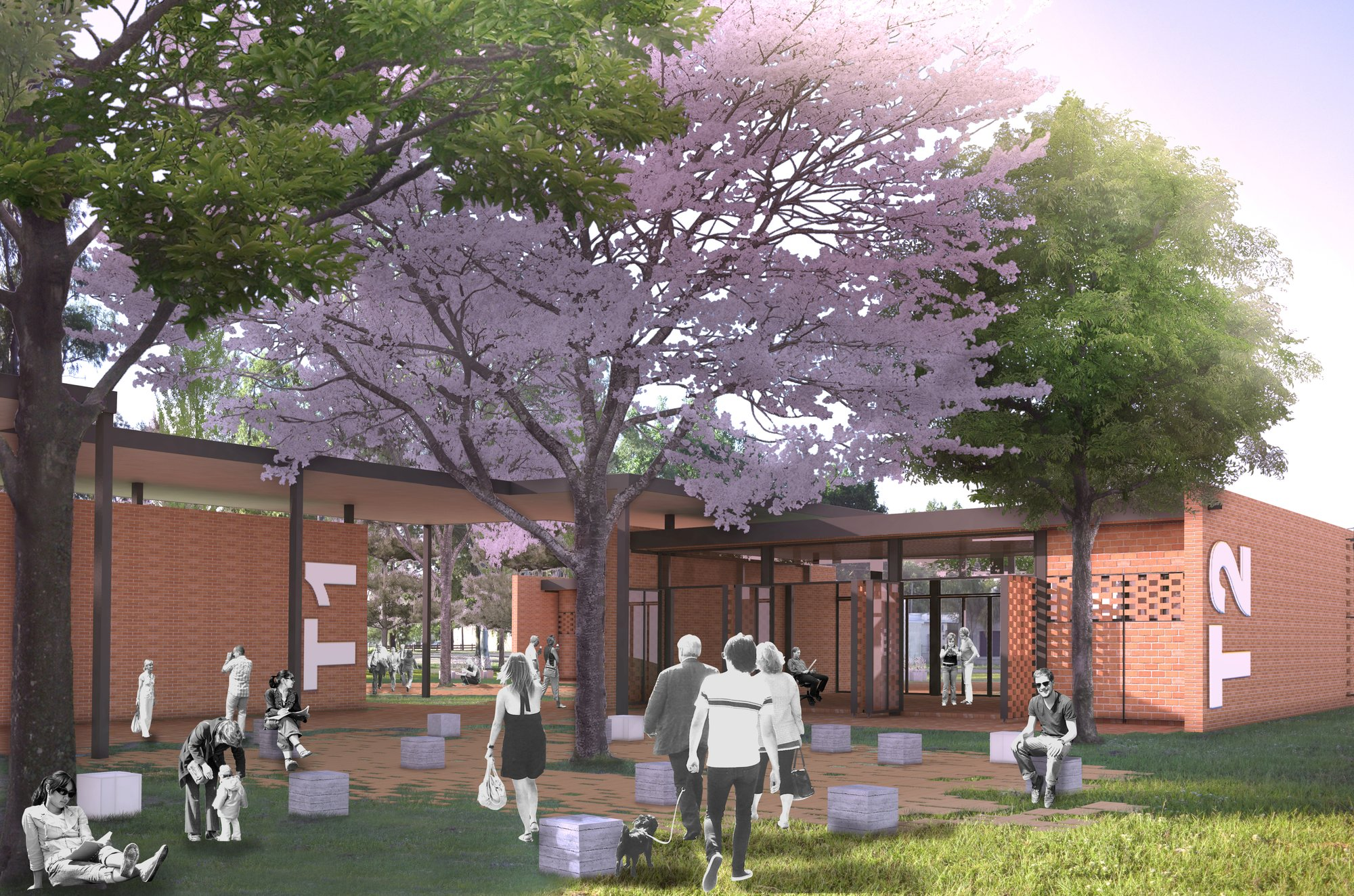 Open courtyard connecting modular classrooms with shaded walkways and landscape integration