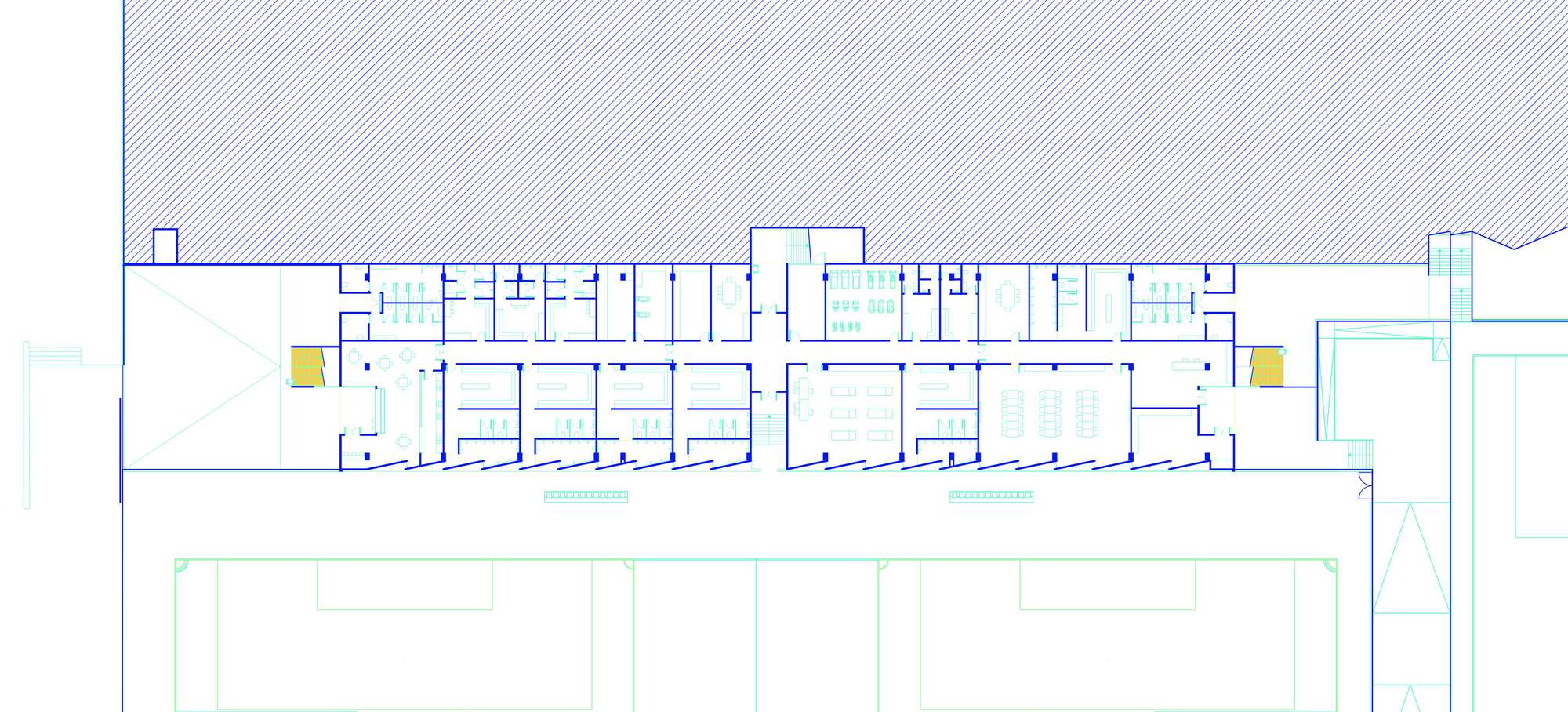 Floor plan drawing showing the linear grandstand building with symmetrical rooms and yellow circulation cores