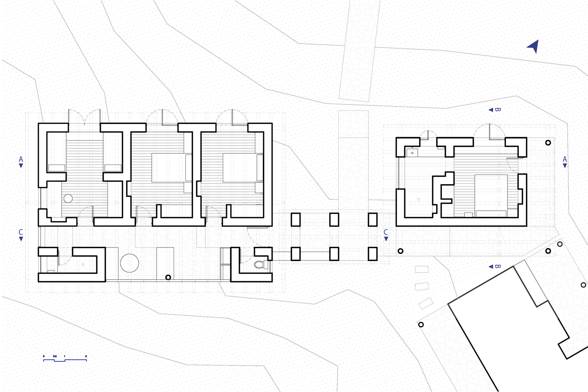 Floor plan drawing showing interconnected pavilions with thick walls and central courtyards