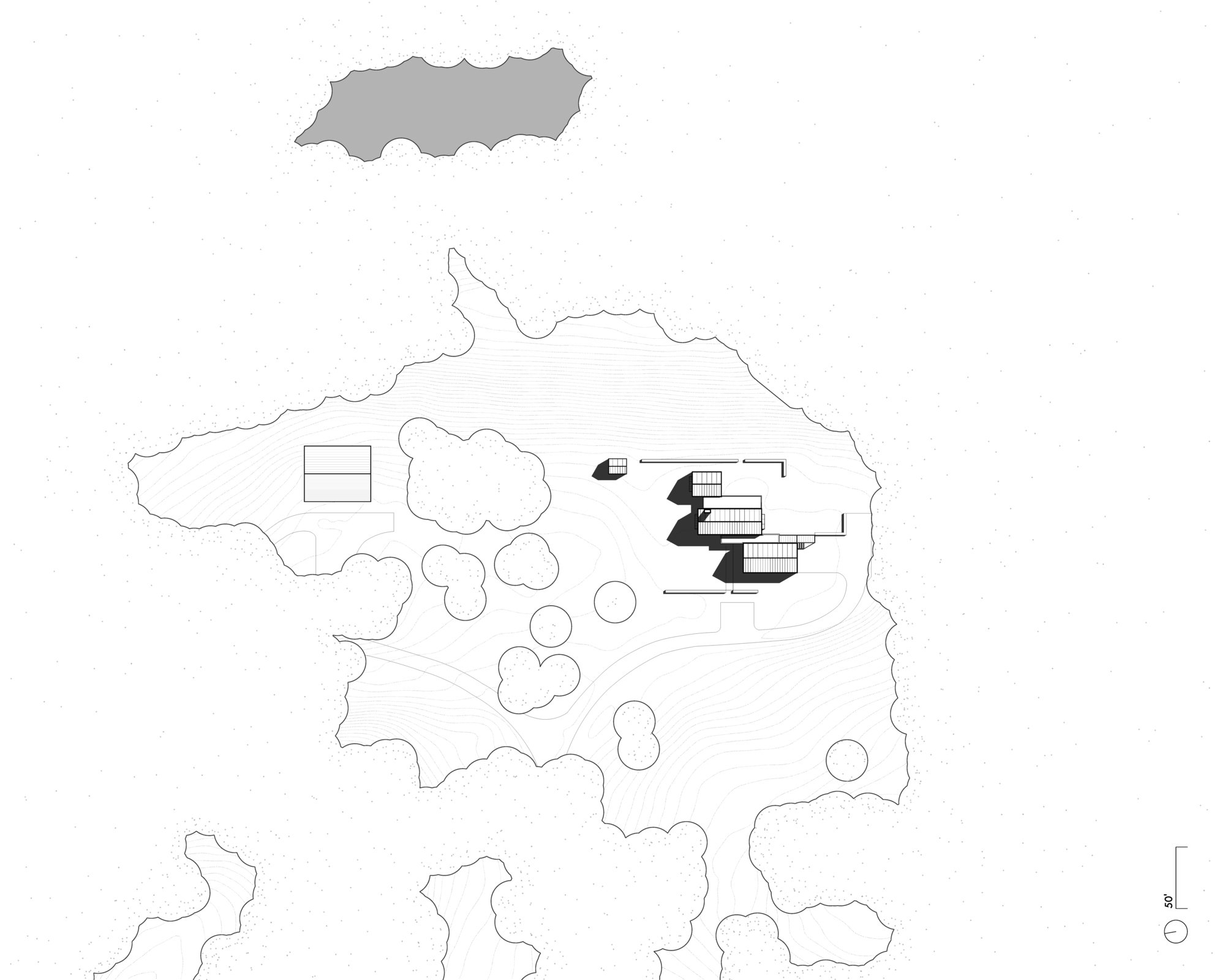 Site plan drawing showing the building footprint surrounded by landscaping and topography contours