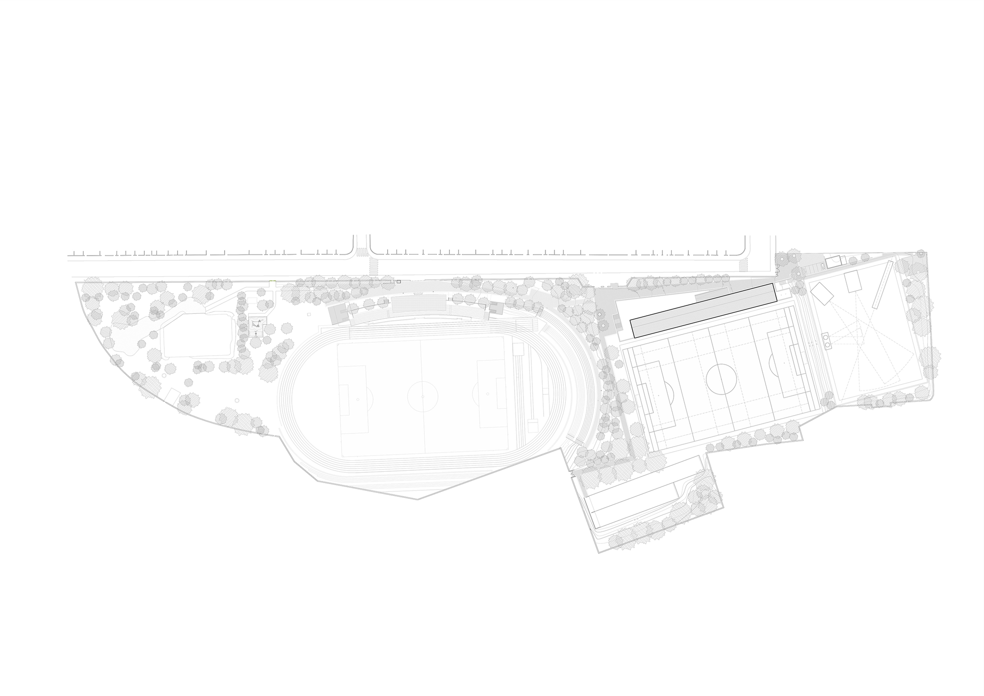 Site plan drawing showing an oval athletic field, adjacent building volumes, and landscaped areas