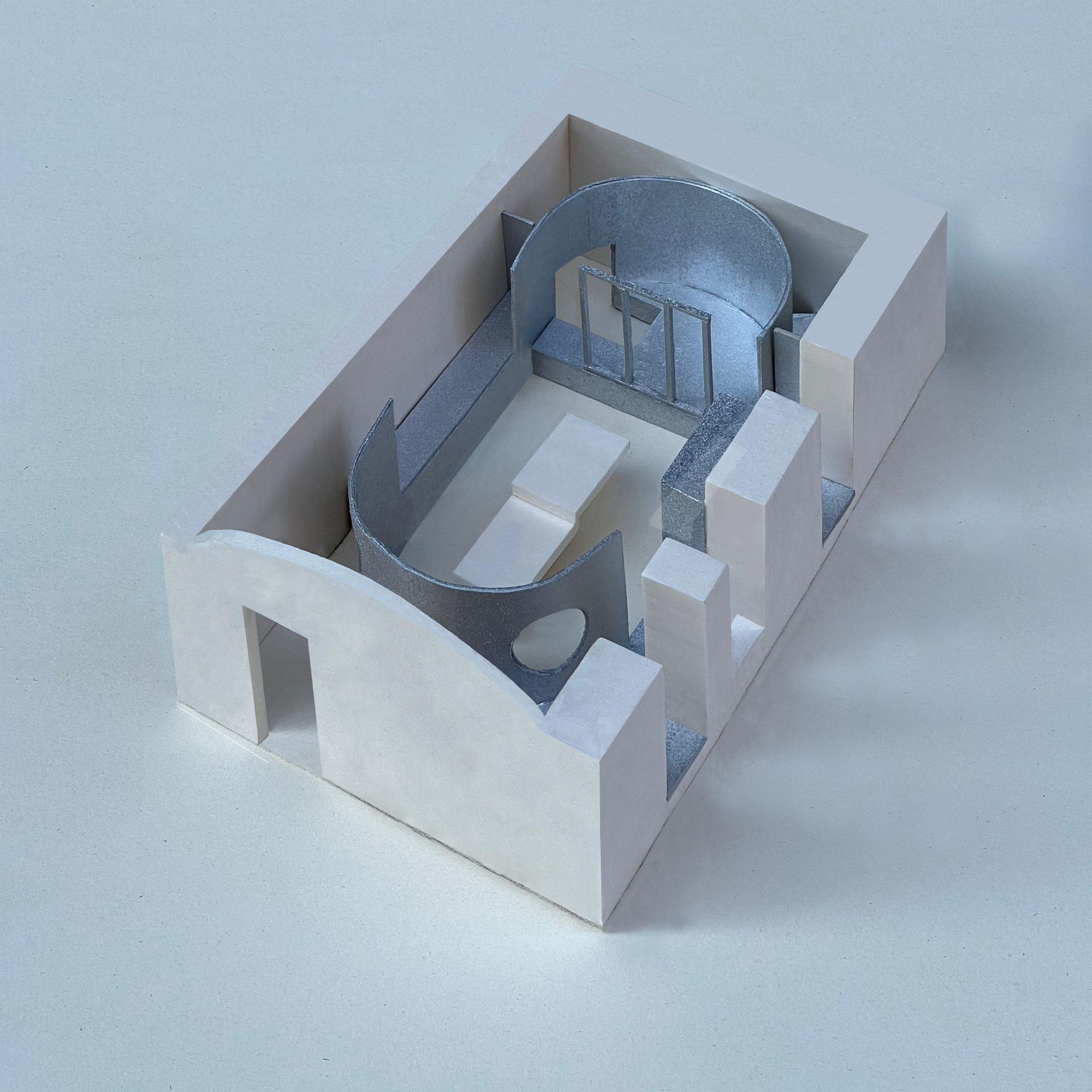 Physical model revealing the oval vault and rectangular enclosure with white and grey materials