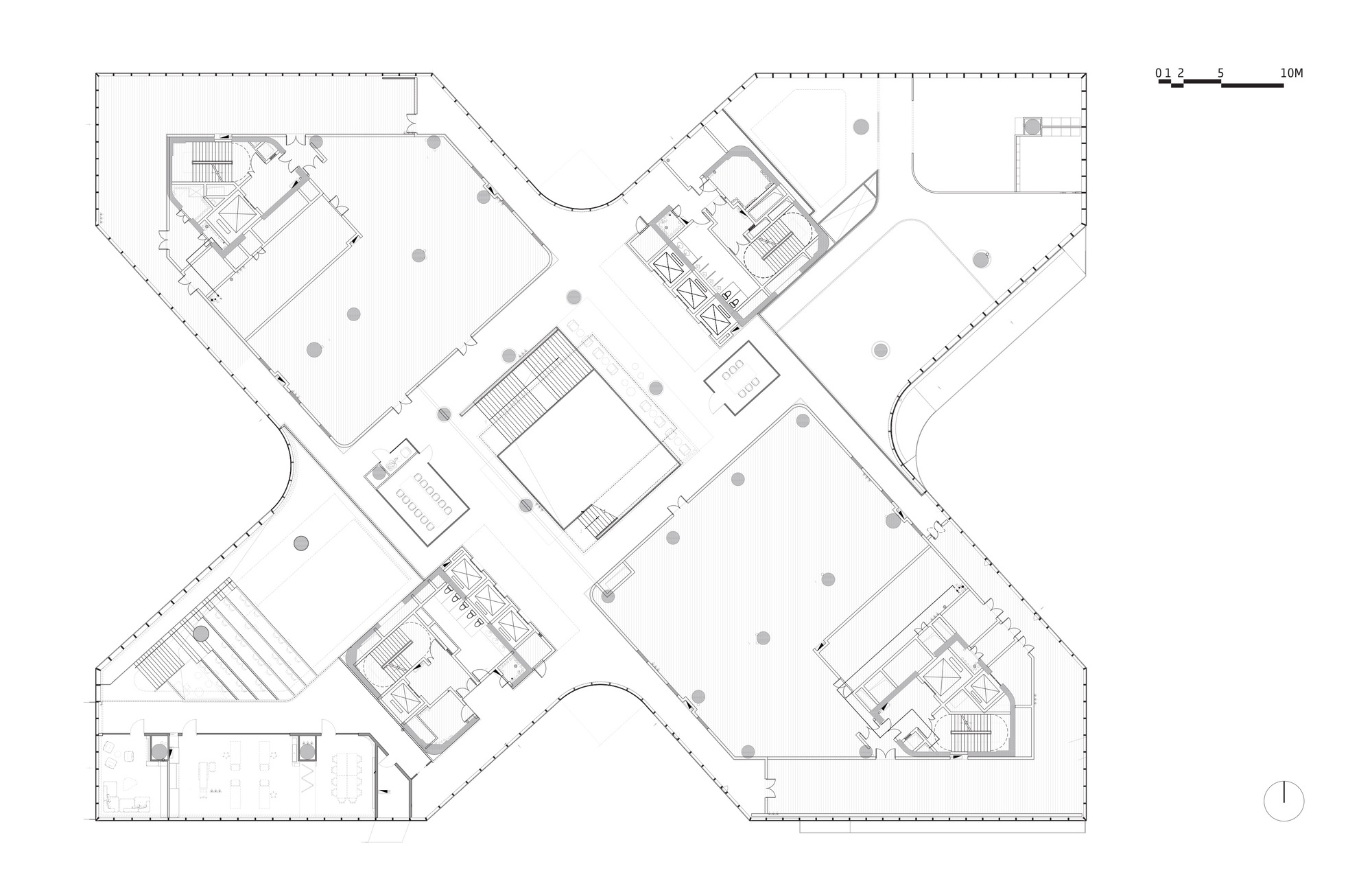 Floor plan drawing depicting four angular wings with central core and scattered structural columns