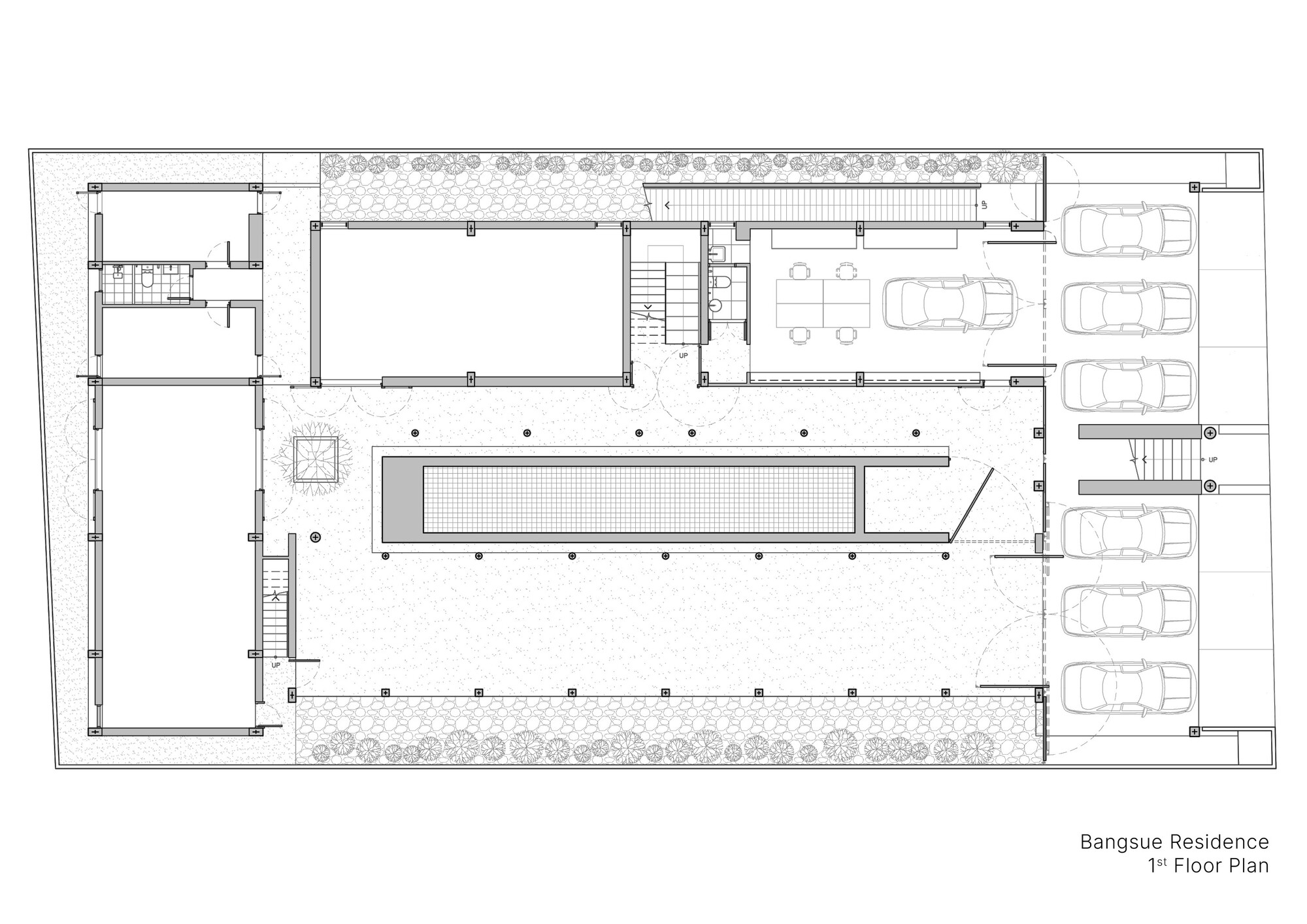 First floor plan drawing showing a central swimming pool flanked by interior rooms and parking spaces