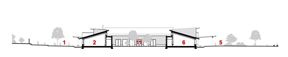 Section drawing showing the varying roof pitches and interior volume relationships across the building