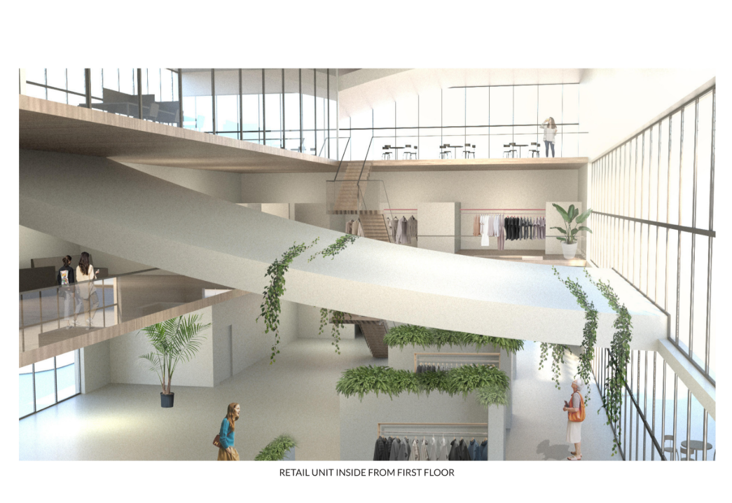 Interior view of the retail unit showcasing adaptive reuse spaces integrated with fluid circulation and natural light.