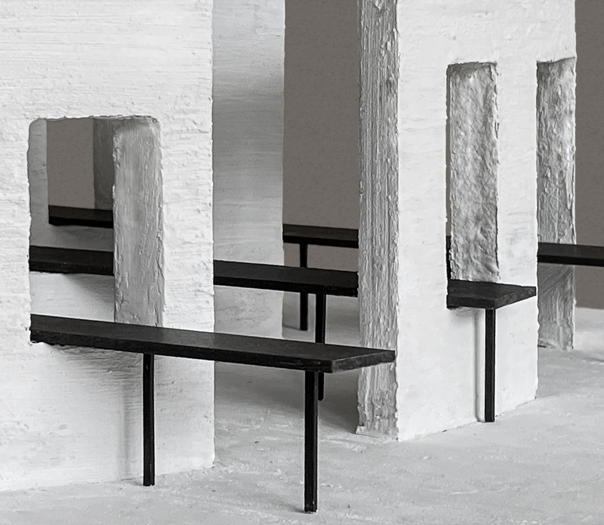 Close-up of model detail with rough-edged white panels intersecting black horizontal beams