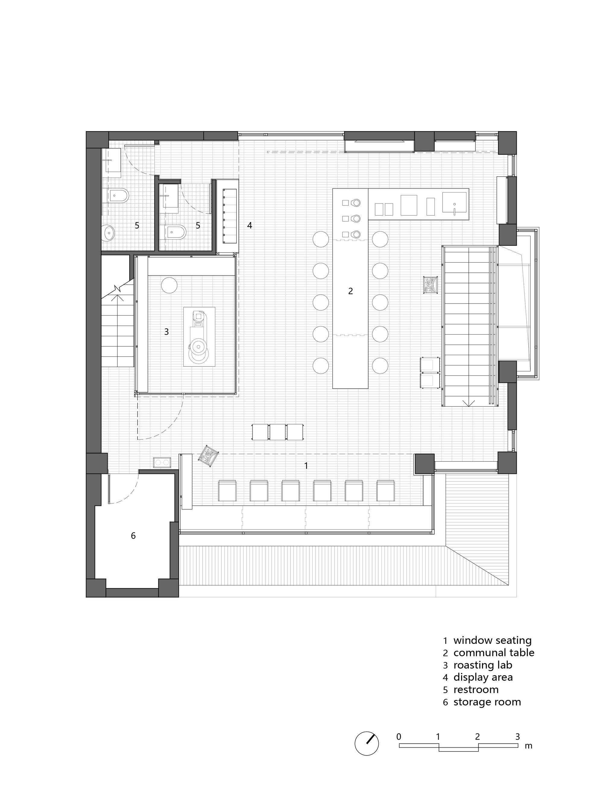 Floor plan drawing showing roasting lab, communal table, and stair cores flanking main space