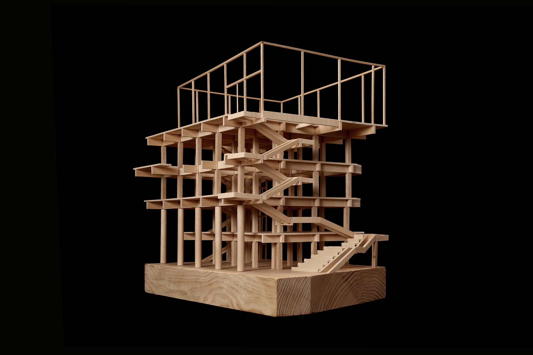 Sectional model showing timber structural frame with curved staircases rising through four levels