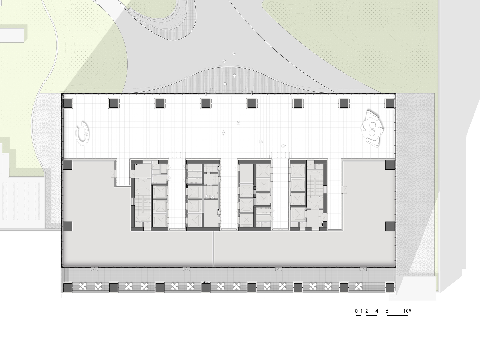 Floor plan drawing showing rectangular layout with central core and perimeter columns along landscaped edges