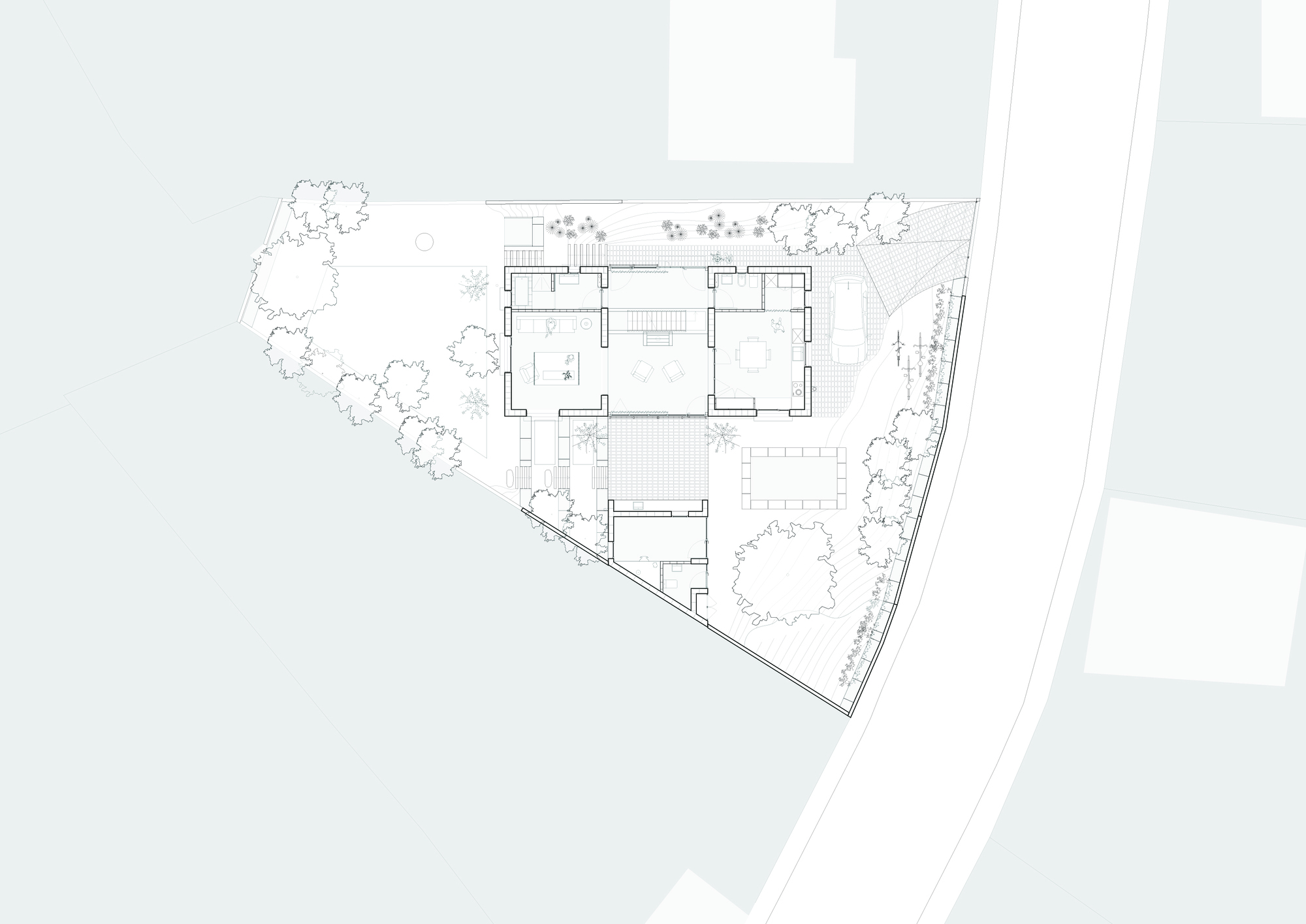 Ground floor plan drawing showing interior rooms surrounded by landscaped gardens on a triangular plot