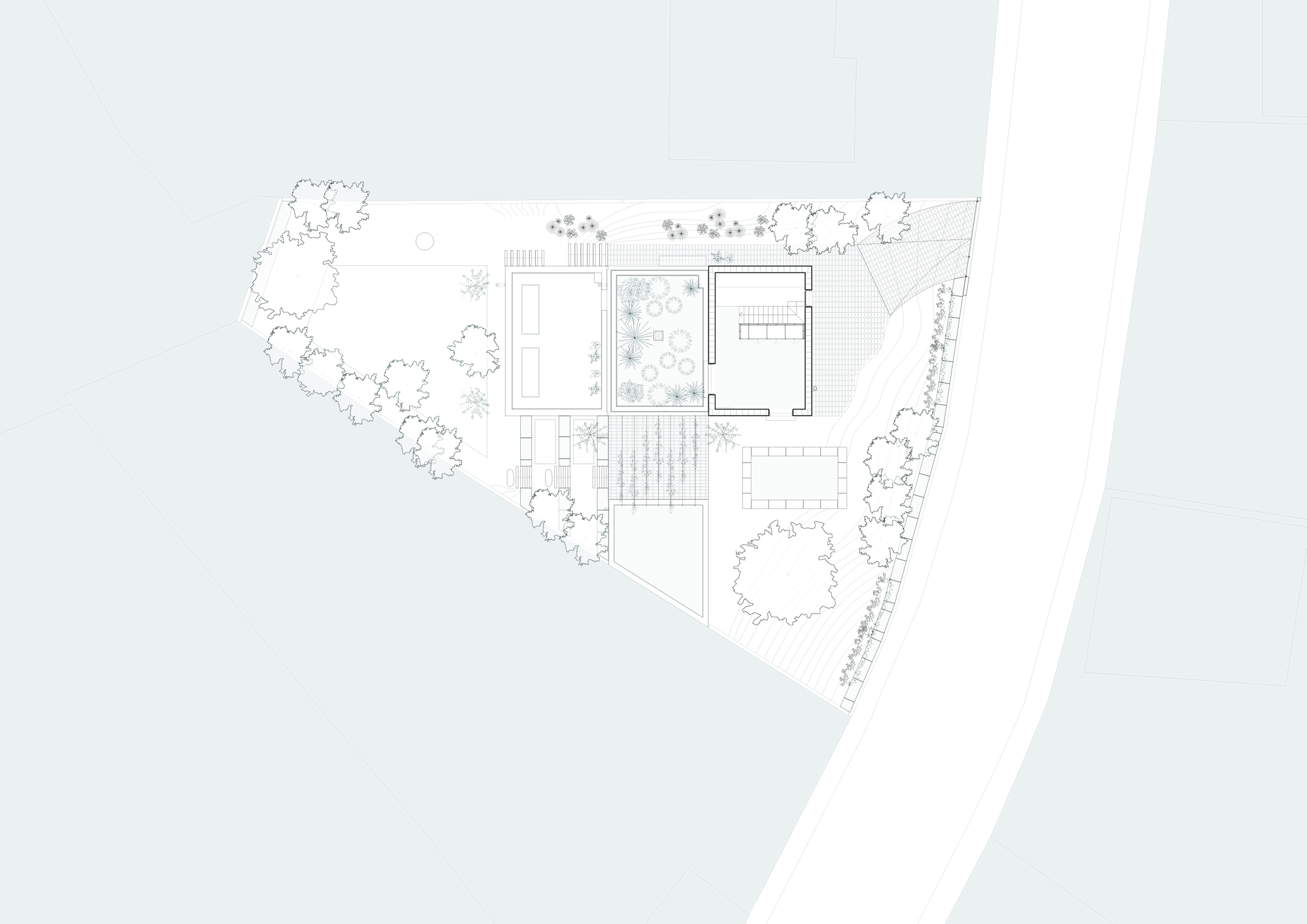 Top floor plan drawing showing rooms with an interior courtyard and rooftop planted areas