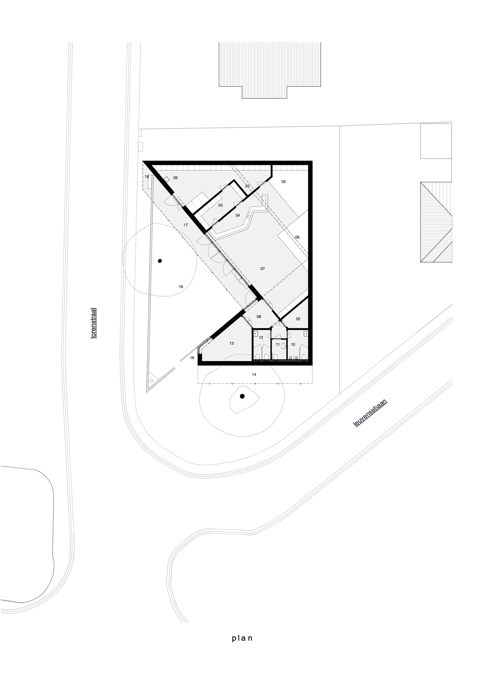 Floor plan drawing showing an angled volume with interior partitions and surrounding circulation paths