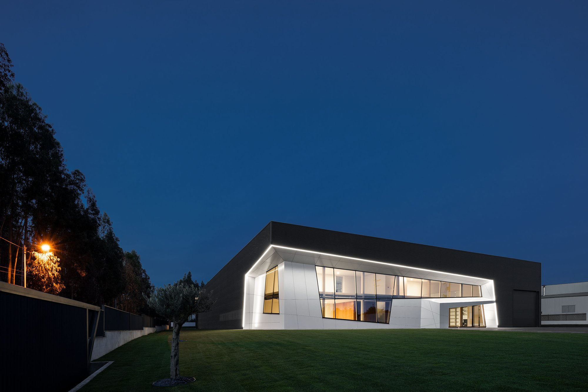 Sharp roofline and angled envelope emphasizing a futuristic architectural language.