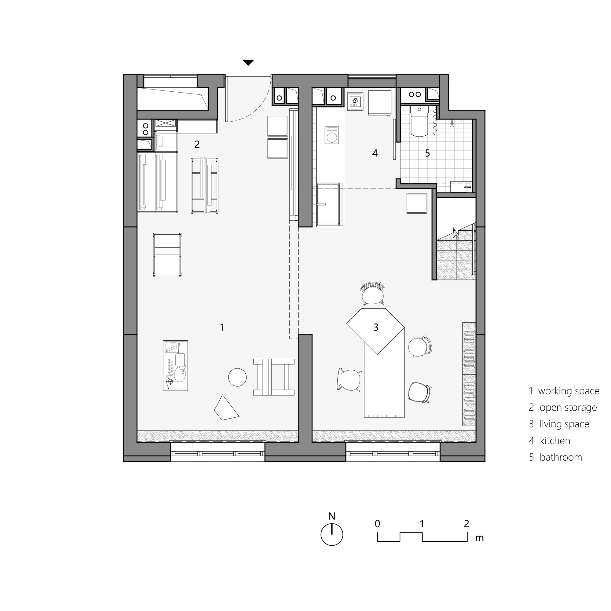 Floor plan showing an open workspace with adjacent storage, kitchen and bathroom