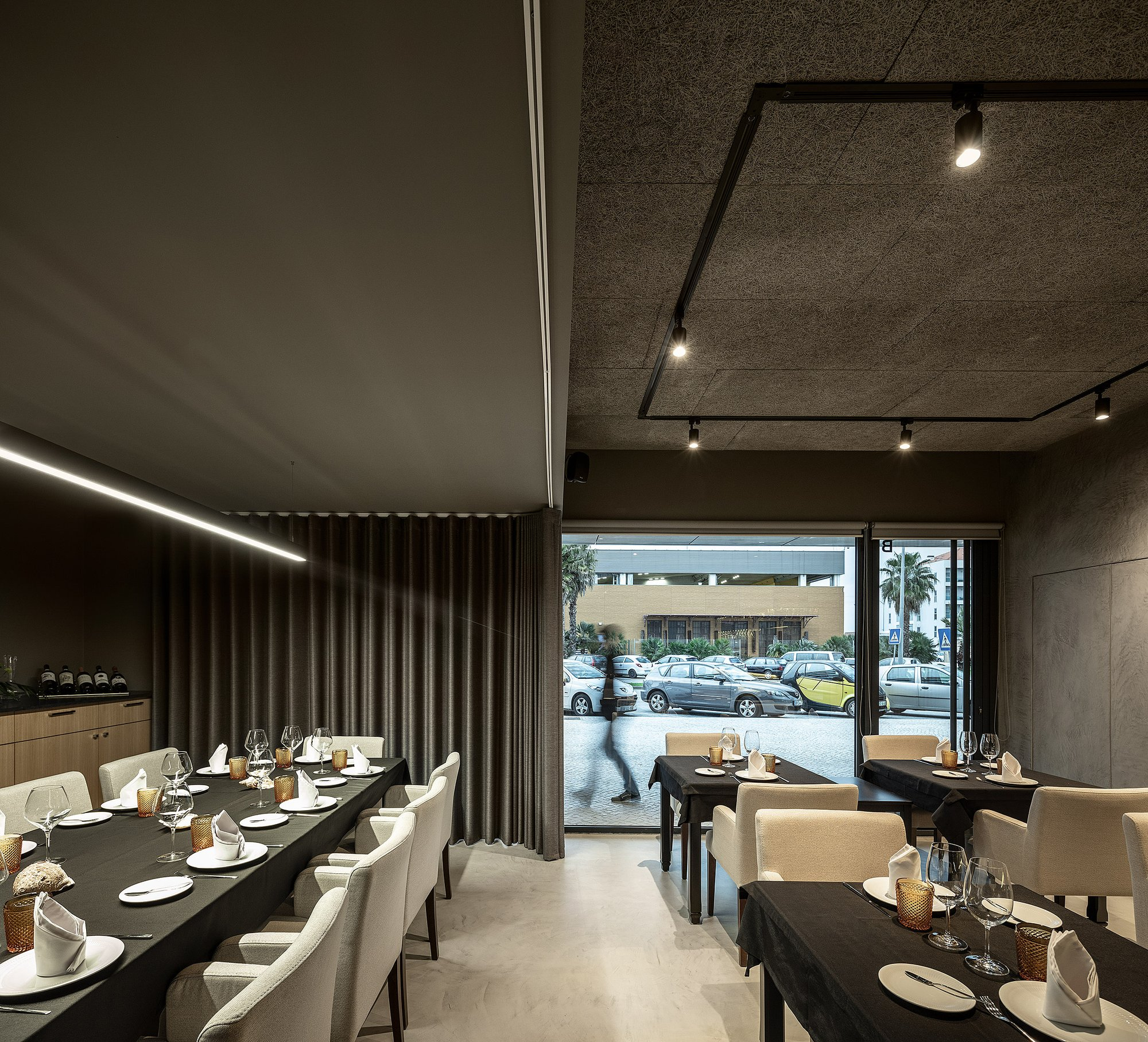 Framed views and layered transparency enhance depth, movement, and spatial experience within the restaurant.