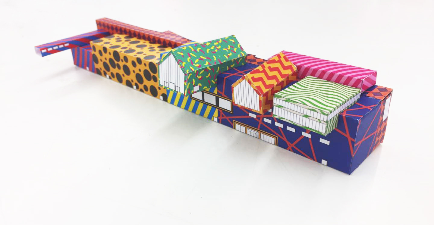 Architectural model with boldly patterned facades in zigzags, stripes, dots and geometric motifs