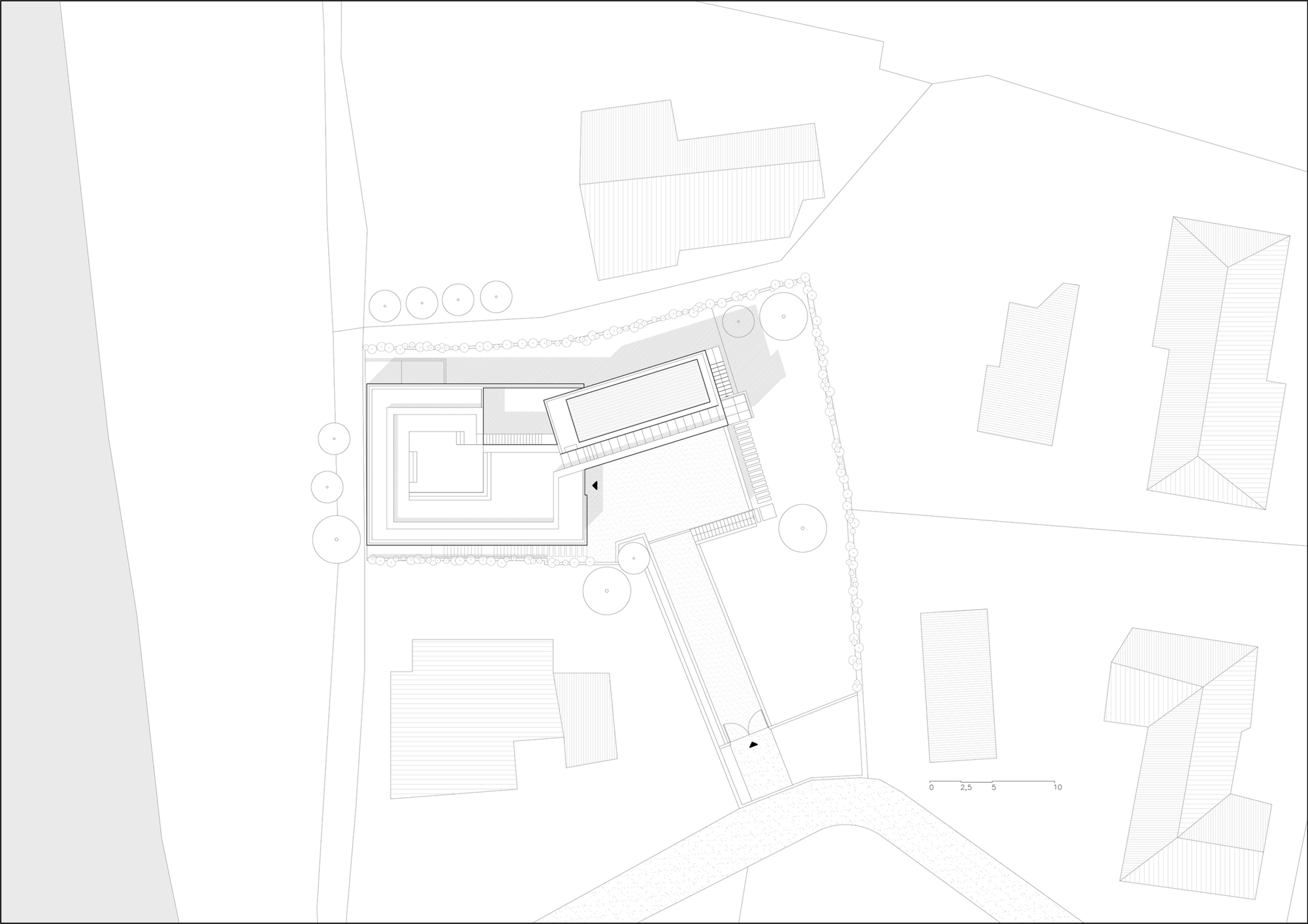 Site plan drawing showing an angular building footprint with courtyard and adjacent structures